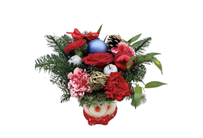 Christmas Smile - Bring joy and festive cheer into any home with Christmas Smile, a charming Christmas arrangement designed to make hearts glow. Presented in an adorable snowman ceramic pot (11 × 9.5 cm), this piece is the perfect blend of colour, warmth, and seasonal magic.
This joyful arrangement features a mix of vibrant red roses, festive carnations, fresh evergreen foliage, playful Christmas baubles, rustic wicker accents, and a natural pine cone—all arranged to celebrate the spirit of the season. Cheerful, colourful, and full of character, it’s an ideal gift for friends, family, teachers, colleagues, or as a cute addition to your own Christmas décor.
Whether placed on a desk, coffee table, or as a small centrepiece, Christmas Smile brings an instant touch of happiness and holiday sparkle.